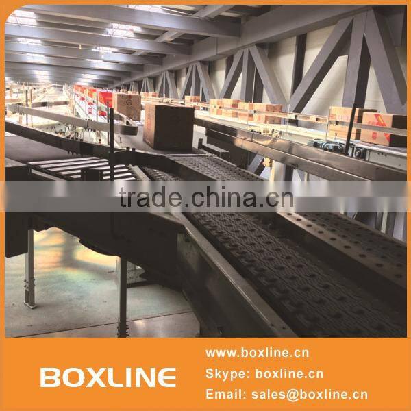 Flexible mesh conveyor for heavy cartons