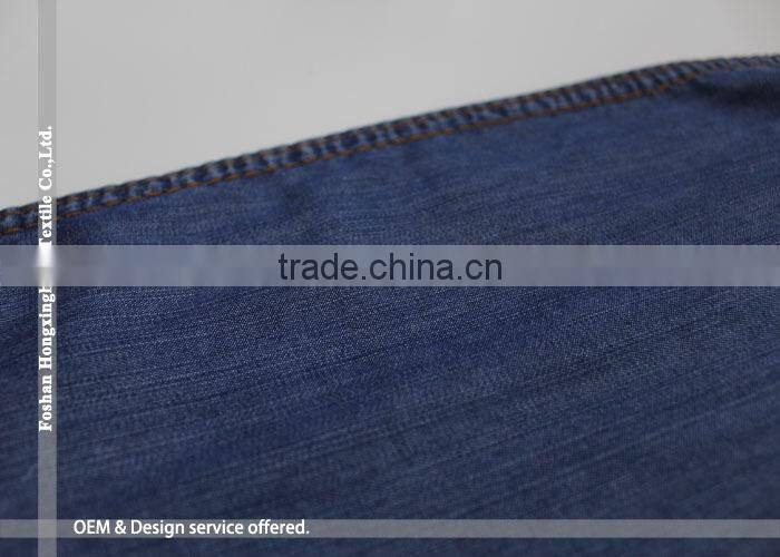 Wholesale large quantity supplier Plain pure 100% Tencel cotton denim fabric for jean garment