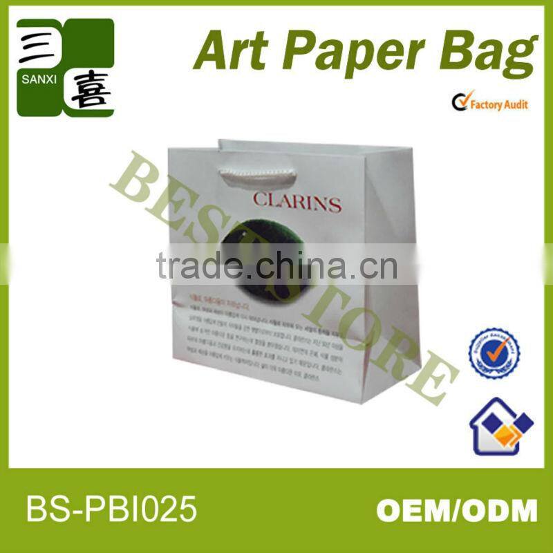 Luxury elegant and white paper shopping bag for clothes with logo