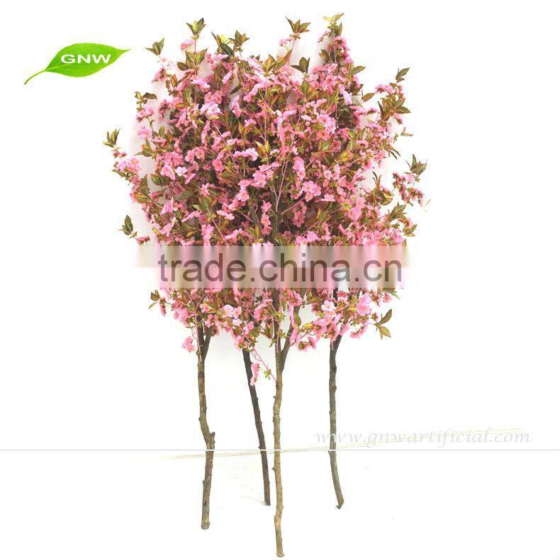 Artificial cherry blossom branch as wedding centerpiece for wedding table decoration
