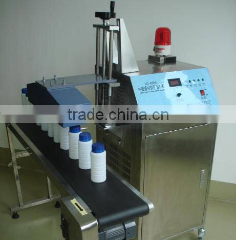 Automatic continuous electromagnetic induction aluminum foil jar heat sealing machine