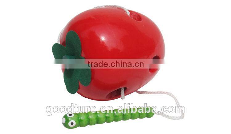 Wooden Caterpillar Eating Red Apple