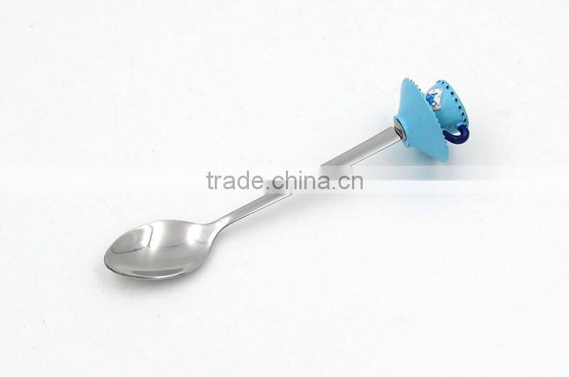 Green colored tea cup handle cake spoon