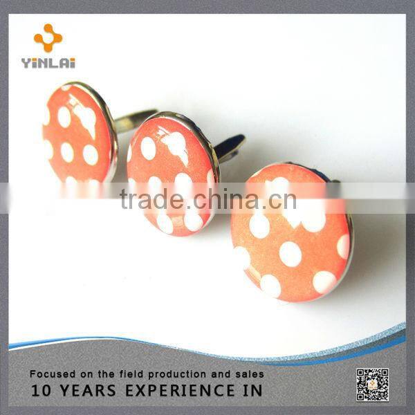 Orange spot decorative metal brads
