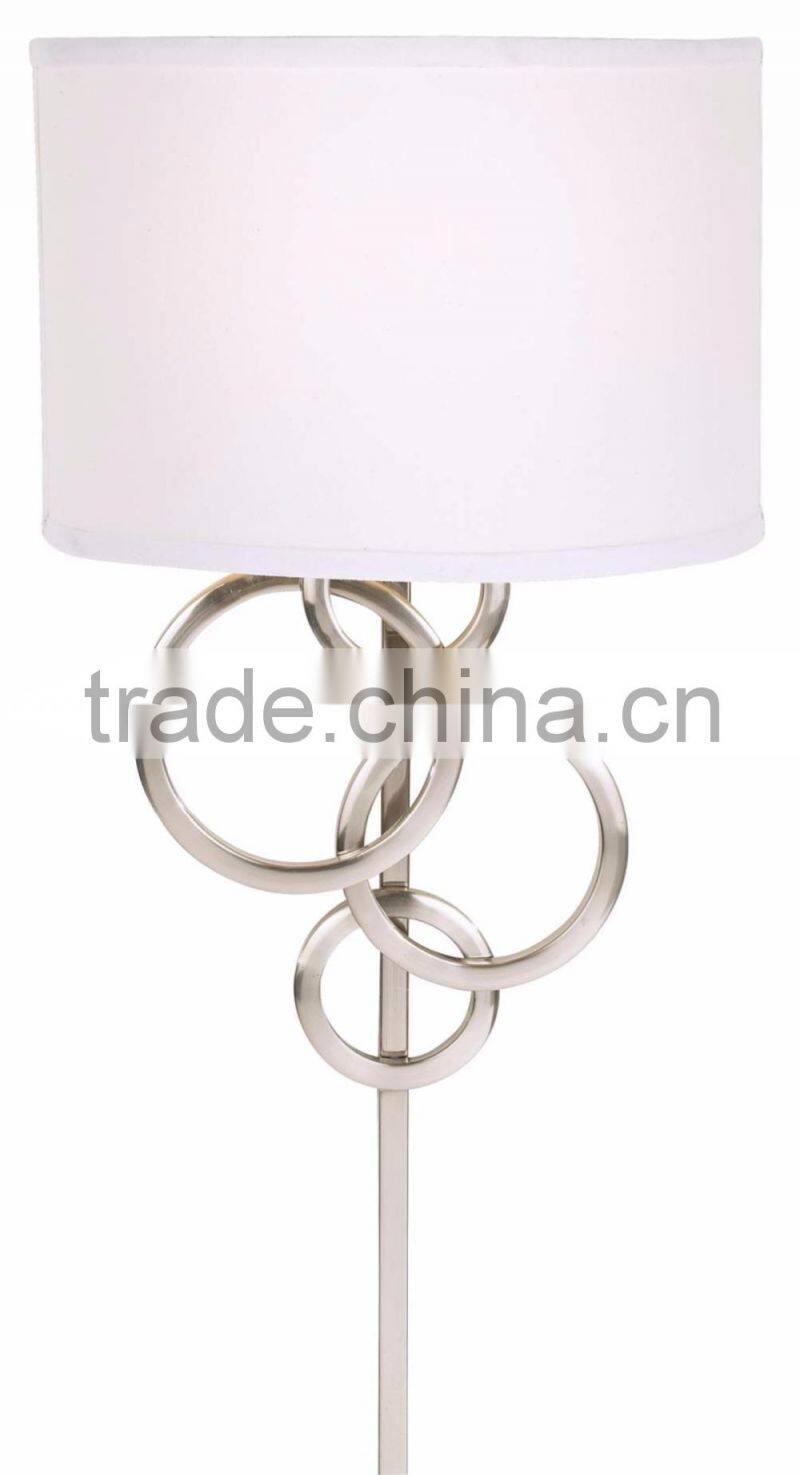 1017-1 sleek brushed steel finish raindrops falling on a calm body of water intertwining Circles Plug-In Wall Sconce