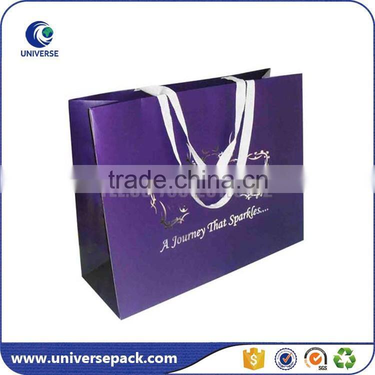 Customized paper packaging bag with handles and logo