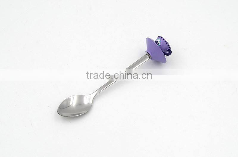 Green colored tea cup handle cake spoon