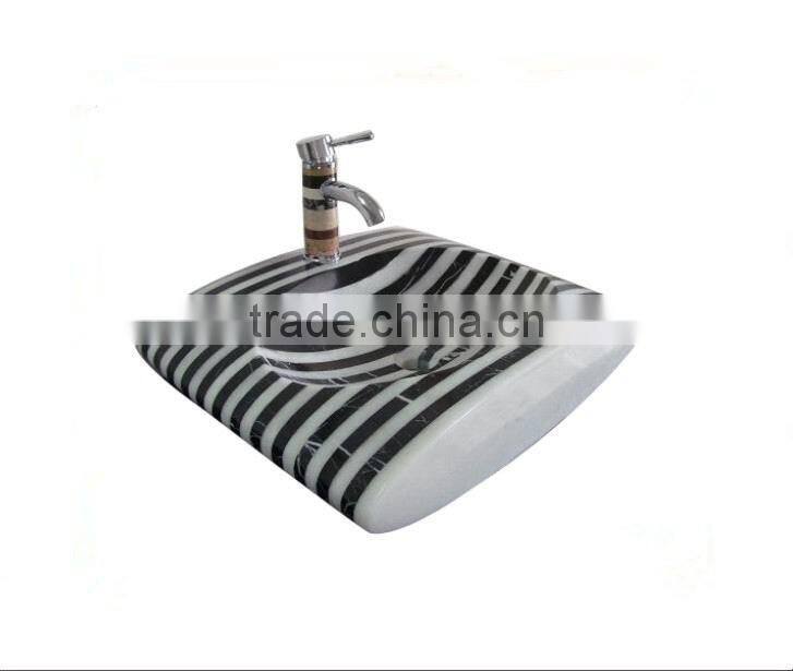 Polished black and white marble mosaic sink