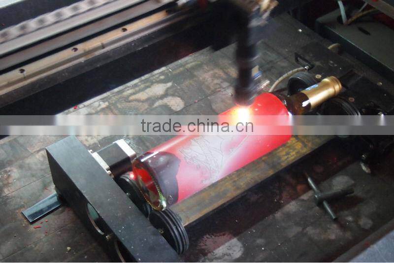 laser rotary engraving on glass bottle