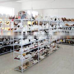 Furry toy looking up lifelike fake animal gorilla