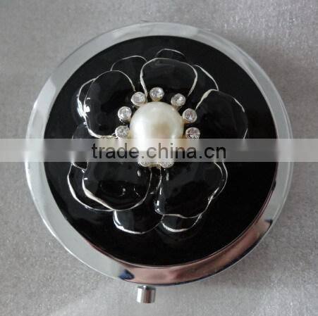 small black round compact mirror with decorative Eiffel Tower decor