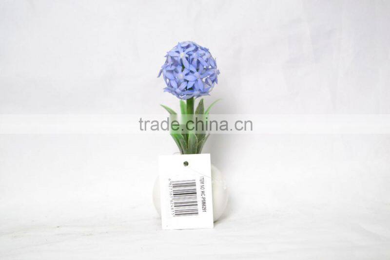 Artificial flower planted in ceramic pot for home decoration