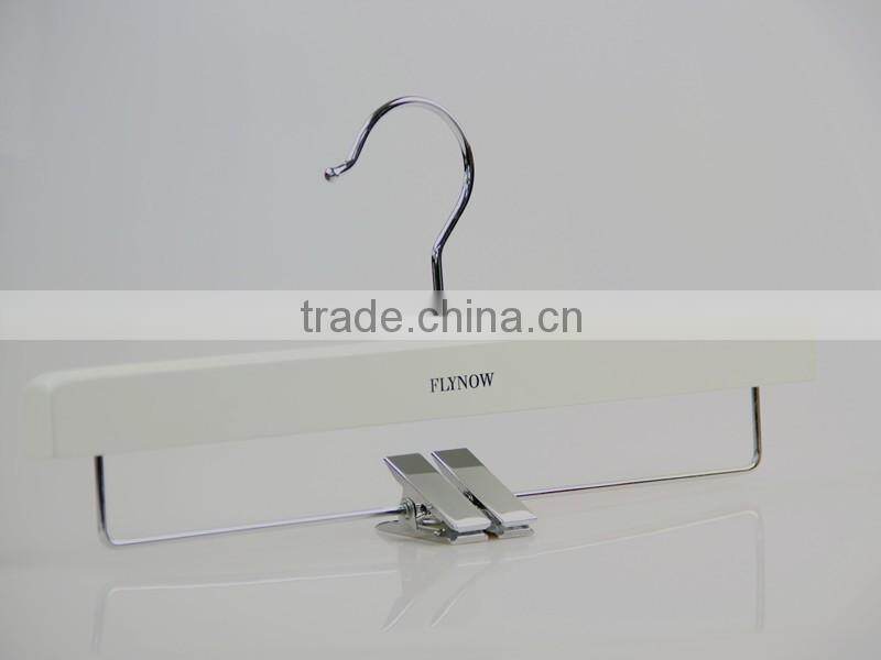 white wooden hanger and pants hanger for luxury garment