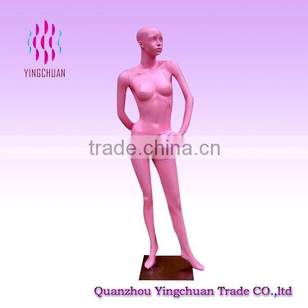 Window display standing fashion pink female mannequin