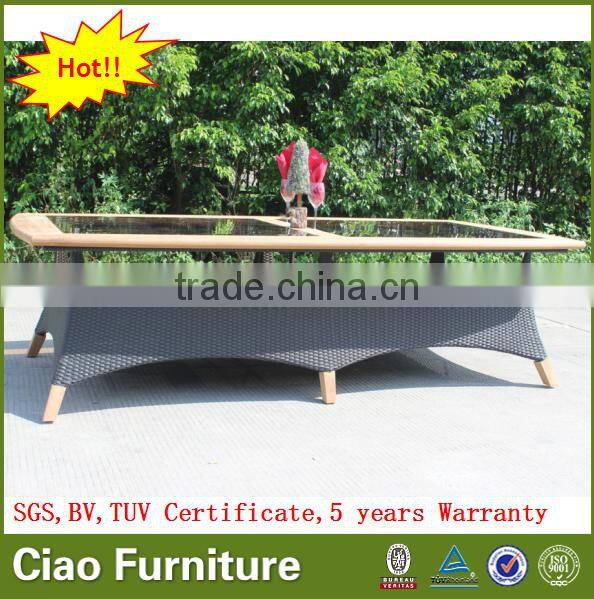 Luxury outdoor extended glass dining table and teakwood chairs
