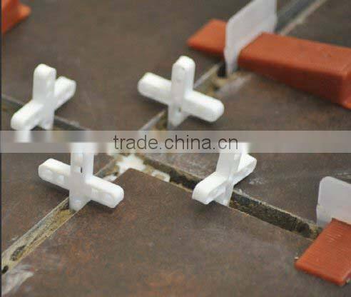 Plastic medium tile leveling system