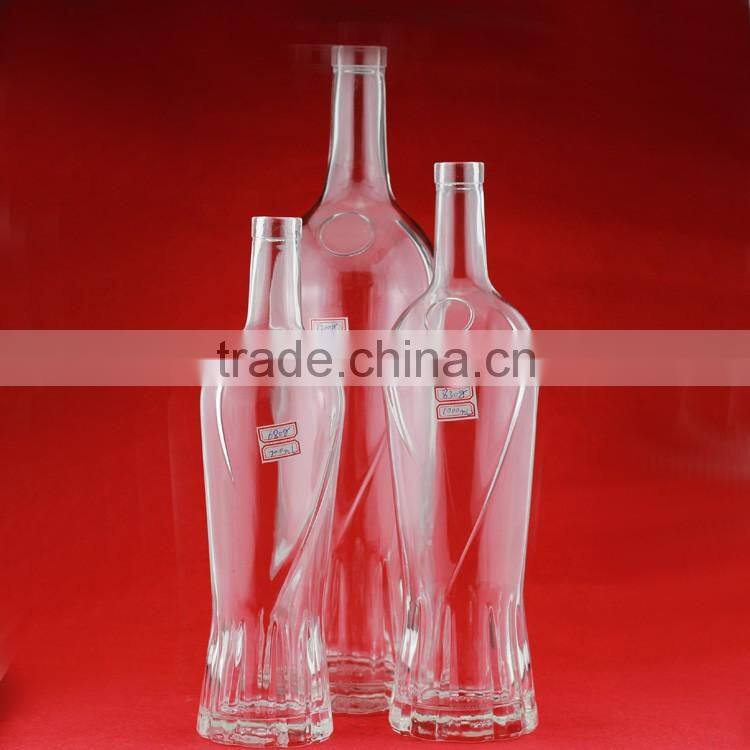 Hot selling cheap embossed spirit bottles glass vodka bottles 700ml french brandy bottle with cork
