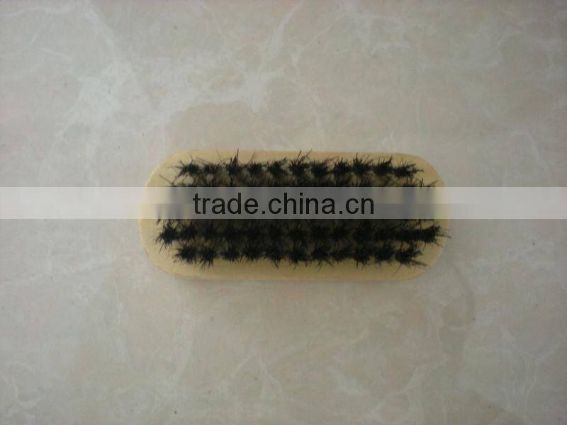 small wooden shoe brush