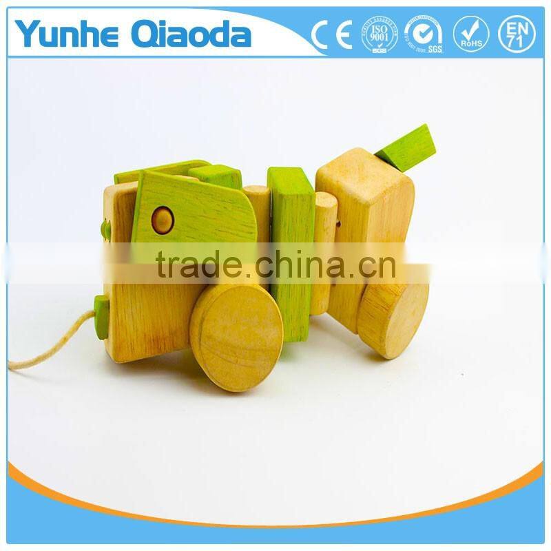 Pull Along Dog Wooden Toy wiggles as you pull they make a clicking sound and make a fun baby