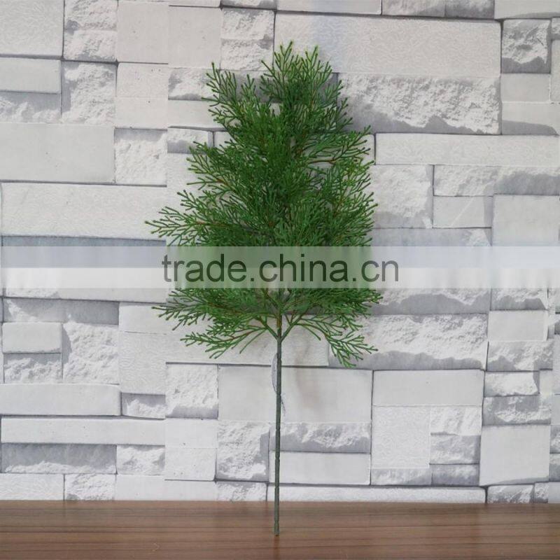 Plastic green cypress branch