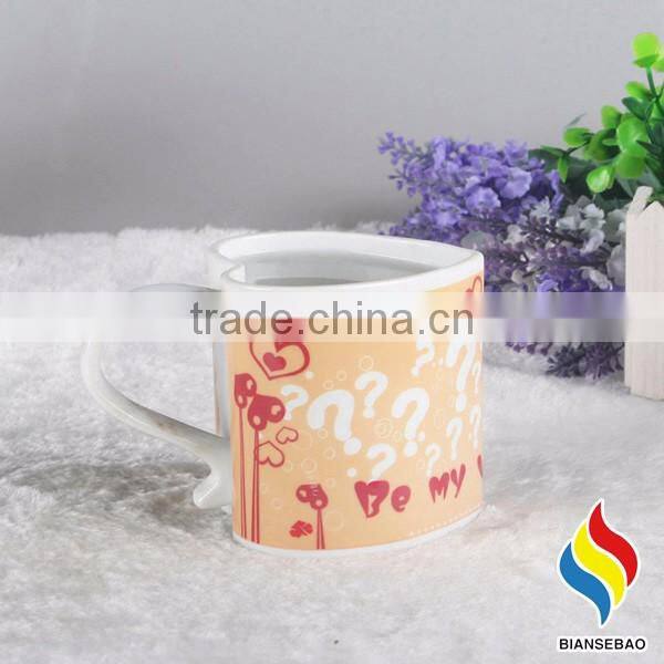 heart shape ceramic mug with revolving logo