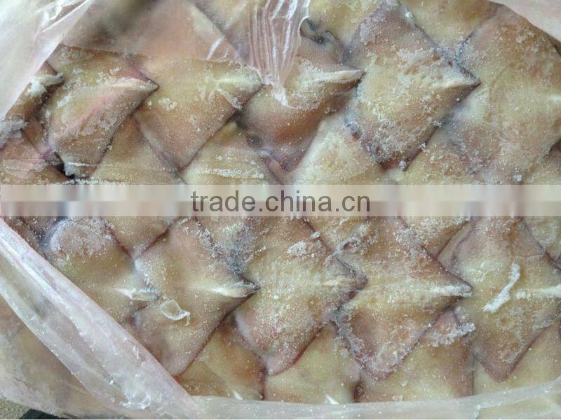 Frozen squid wing after glazing