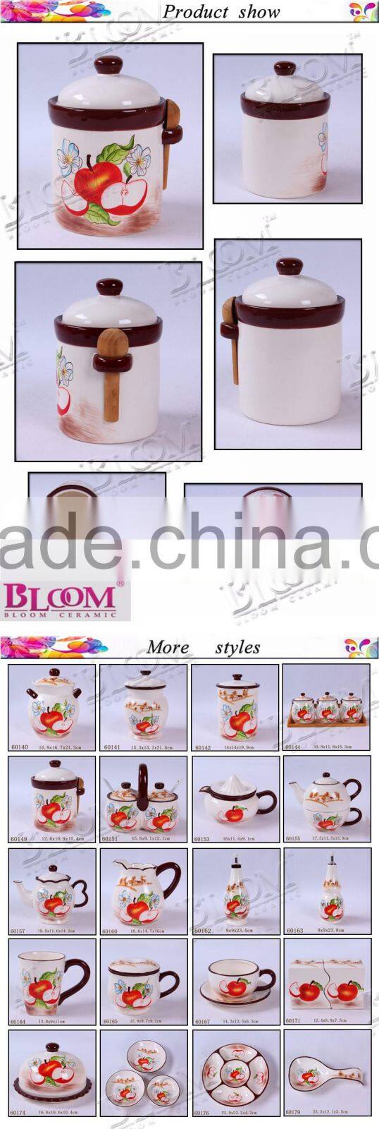 ceramic kitchen coffee canister with wood spoon
