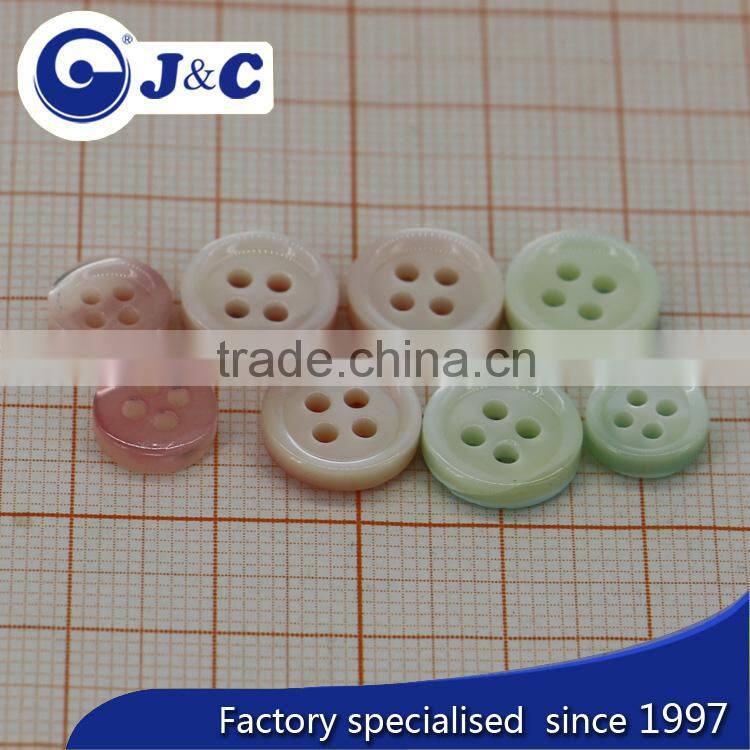 bottom with spray painting trocas shell buttons