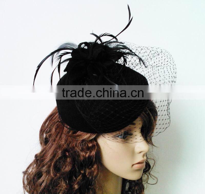 Felt fascinator trimming with veiling and feathers