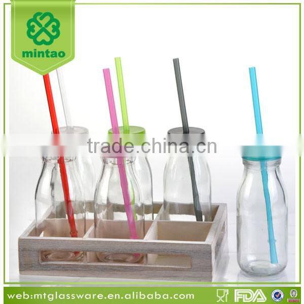 display box packing small glass bottles with lids and paper straw