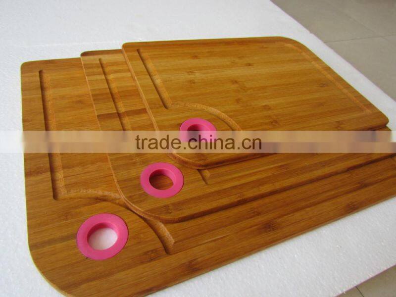 Three size bamboo cutting board with silicon handle