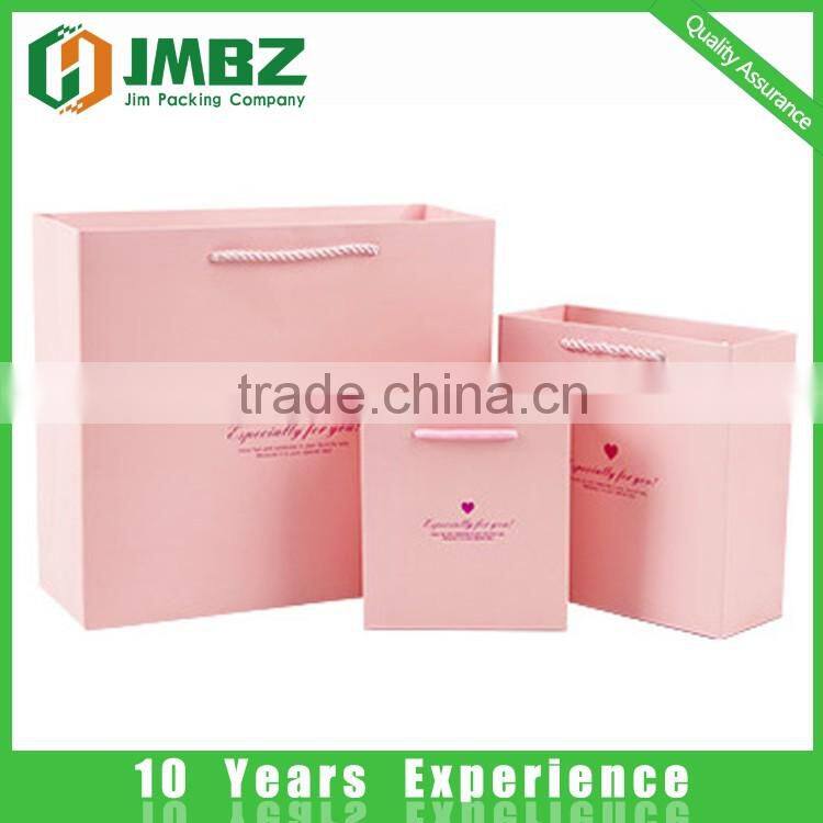 Custom made design and logo printed shopping paper bags with handles