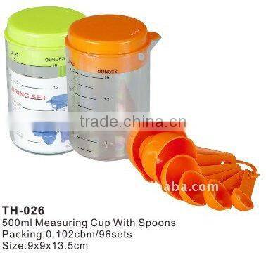 plastic measuring cup with spoons
