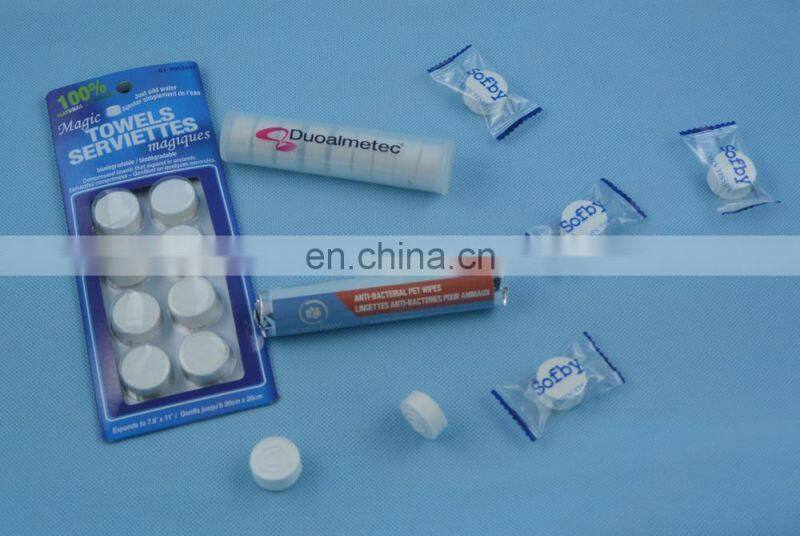 Eco friendly100% rayon material OEM compressed tissue/magic coin hotel napkins/paper roll compressed tablet wipe