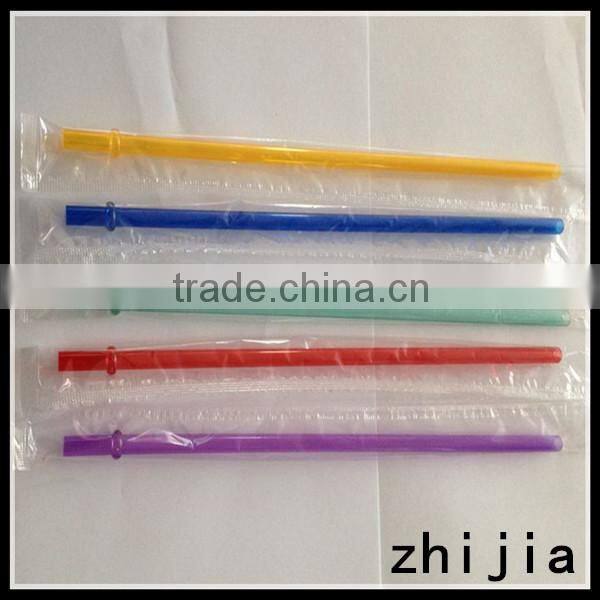 Clear wrapped red plastic drinking straw