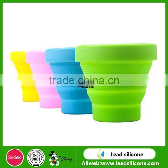 Heat resistant collapsible double wall glass cup with silicone lid