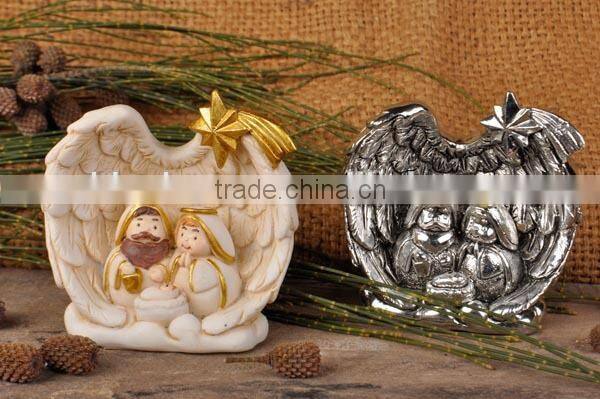 Resin nativity set in wing embrace
