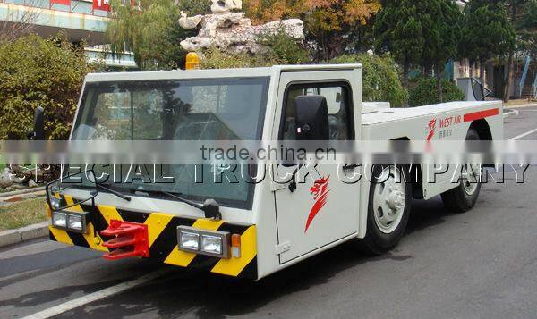 airplane aircraft dragging towing tractor