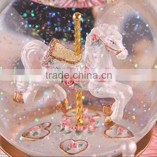 Exclusive resin carrousel rotate LED music snow globe