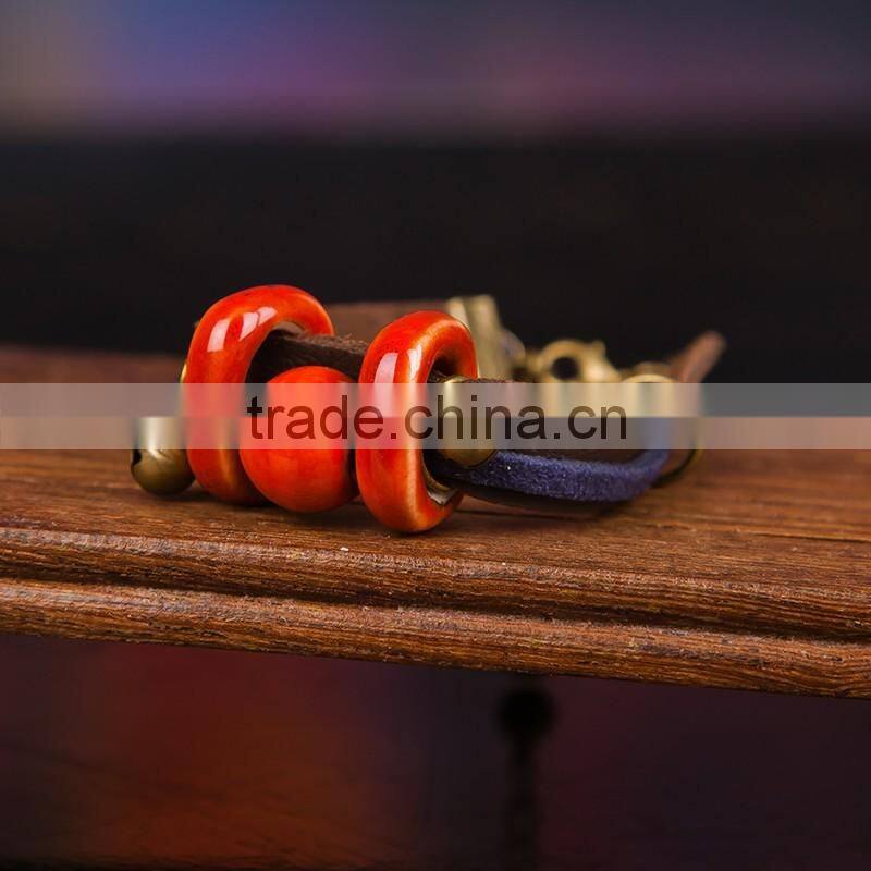 Retro Chinese Red Handmade leather Ceramic bead bracelet with bell on it