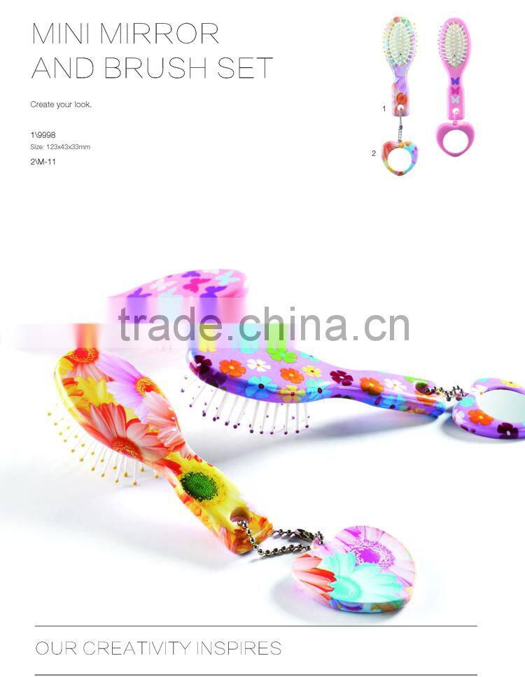 Raffini New Patterned Top selling Plastic with Swirl design Handle Paddle hair brush