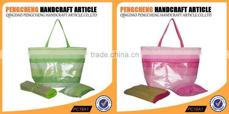 Stripe paper straw material beach bag containing the mat and pillow