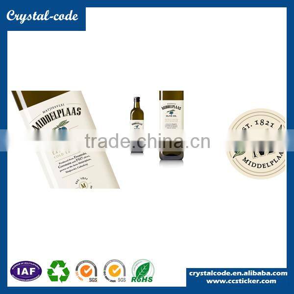 Adhesive waterproof labels for essential glass olive oil bottles