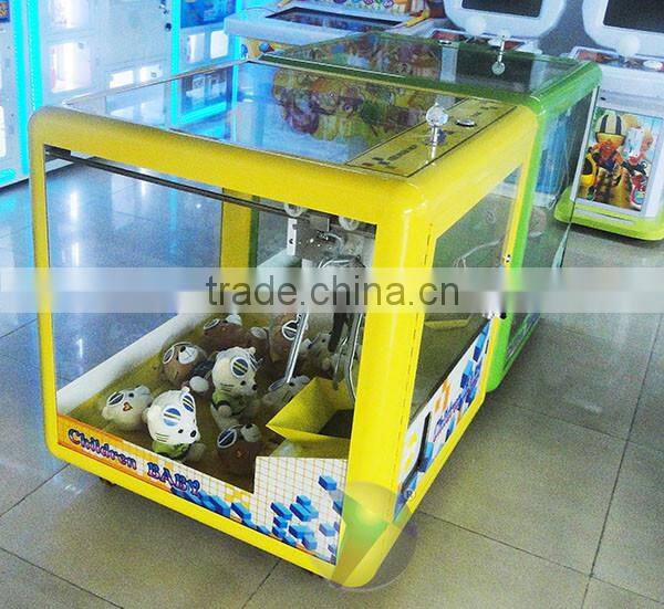 new design toy gift coin-operated game machine for kids / Magic Doll Cube mini toy crane machine