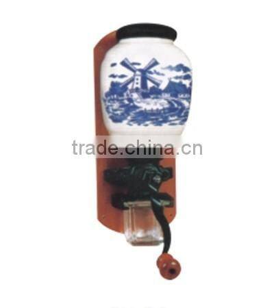 archaistic manual coffee grinder with wooden case