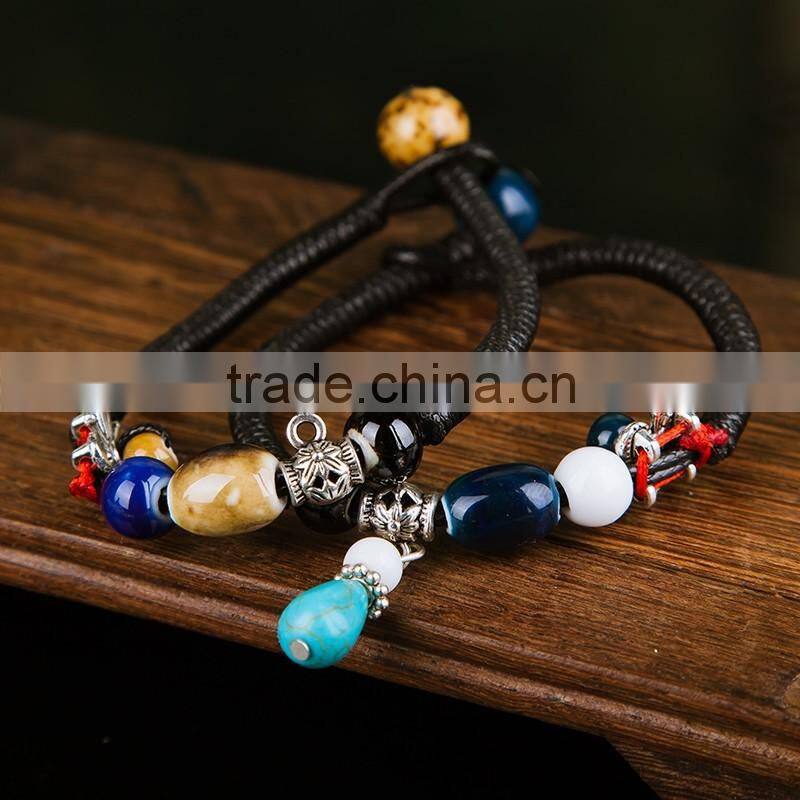 Retro Chinese Red Handmade leather Ceramic bead bracelet with bell on it