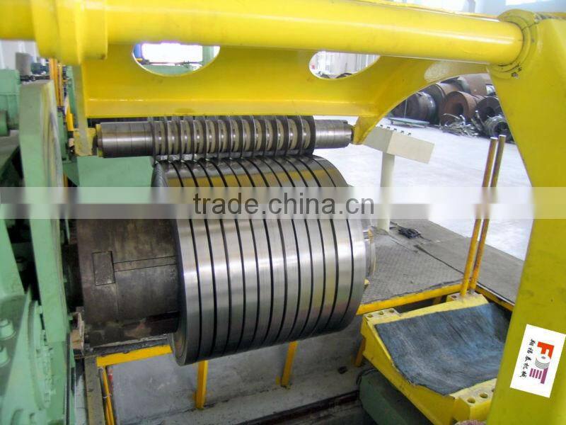 rewinder with hold down arms device