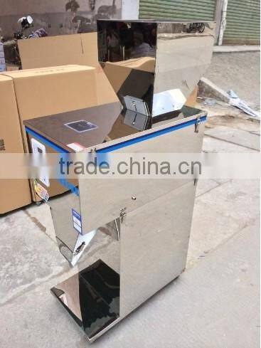 Semi-automatic Stainless steel weighing 10 -999 grams table type filling mchine