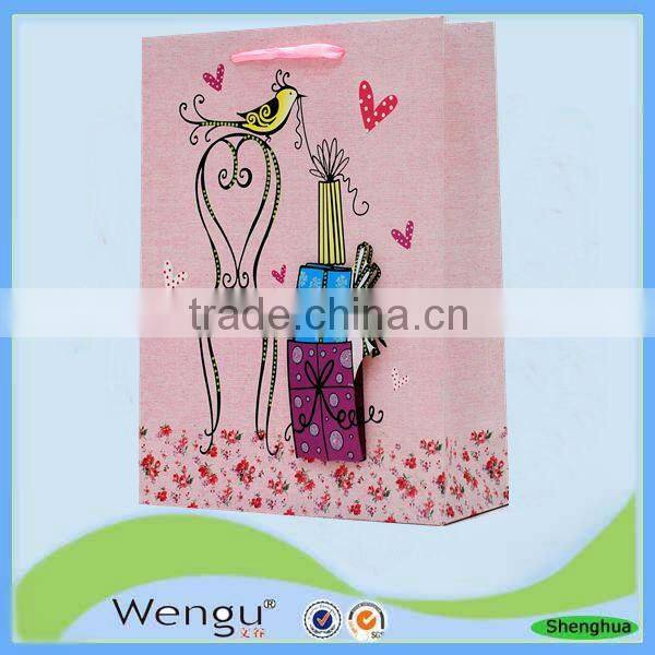fancy present paper bag in unique design with pp ribbon handle made in china supplier and manufacture