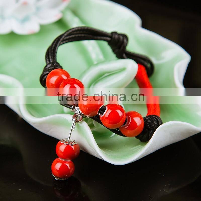 Retro Chinese Red Handmade leather Ceramic bead bracelet with bell on it